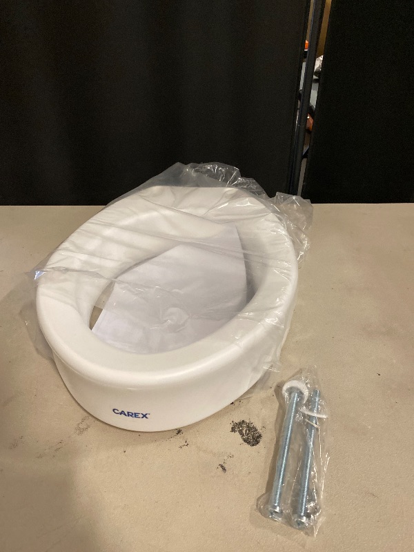 Photo 1 of Carex Toilet Seat Riser, Elongated Raised Toilet Seat Adds 3.5 inches to Toilet Height, for Assistance Bending or Sitting, 300 Pound Weight Capacity Toilet Riser