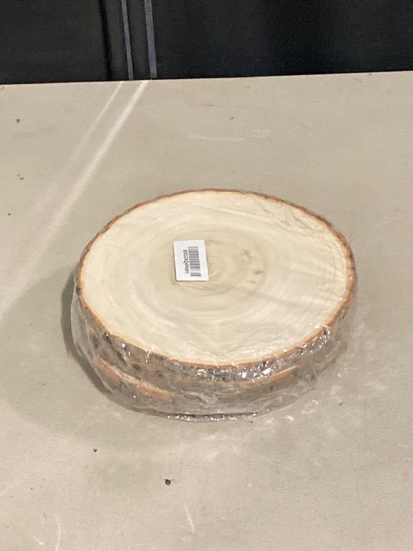 Photo 1 of Prsildan 4 Pack Large Wood Circle Slices, 8 to 10 Inches DIY Unfinished Wood Table Centerpieces, Natural Rustic Round Crafts for Indoor Christmas Wedding Party Décor