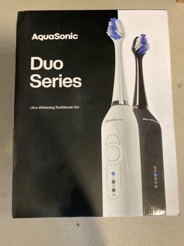 Photo 1 of Aquasonic Duo - Dual Handle Ultra Whitening 40,000 VPM Wireless Charging Electric ToothBrushes - 3 Modes with Smart Timers - 10 Dupont Brush Heads & 2 Travel Cases Included