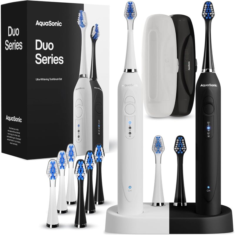 Photo 1 of Aquasonic Duo - Dual Handle Ultra Whitening 40,000 VPM Wireless Charging Electric ToothBrushes - 3 Modes with Smart Timers - 10 Dupont Brush Heads & 2 Travel Cases Included