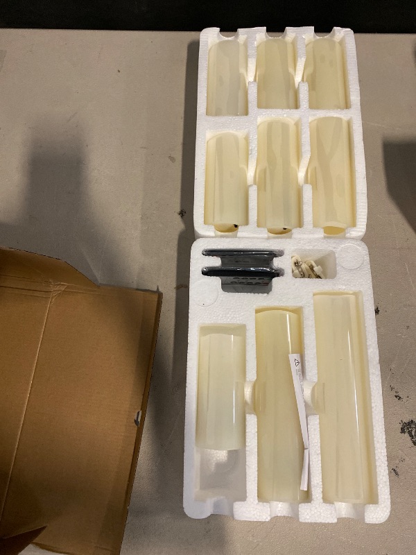 Photo 1 of Flameless Flickering Battery Operated Candles D2.2''*H4 5" 6" 7" 8" 9" Set of 9 Ivory Real Wax Pillar LED Candles with 10-Key Remote and Cycling 24 Hours Timer (Ivory)