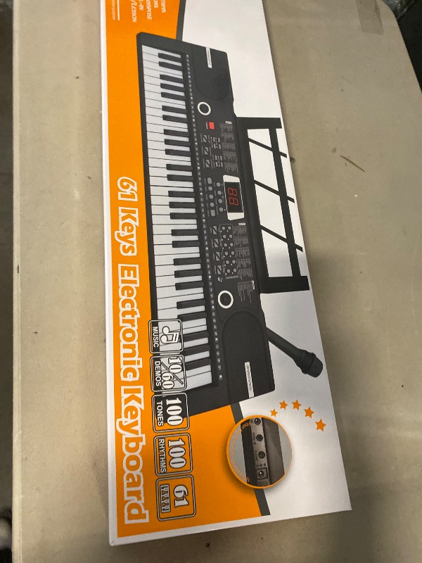 Photo 1 of Electric Piano Keyboard, Digital 61 Key Piano Keyboard Kids with Speaker Microphone & Music Sheet Stand, Gift for Children Early Education Beginners, Black