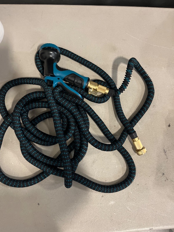 Photo 1 of Flexi Hose with 8 Function Nozzle, 50FT - Lightweight Expandable Garden Hose, No-Kink Flexibility, 3/4 Inch Solid Brass Fittings and Double Latex Core