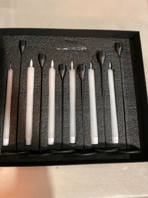 Photo 1 of Homemory 6 Pcs Flameless Taper Candles with Remote Timer and Dimmer, White Candle Sticks Battery Operated, LED Window Candles with Flickering Light, 9.6 Inches for Wedding Home Indoor Decoration