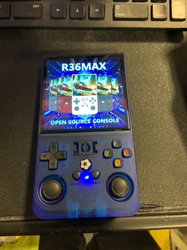 Photo 1 of ?R36MAX 4000mAh Portable Rechargeable Handheld Retro Game Console,Comfort Non-Slip Handheld Standing Retro Game Console with 64G TF Car,4.0-inch Screen,for Office,Blue