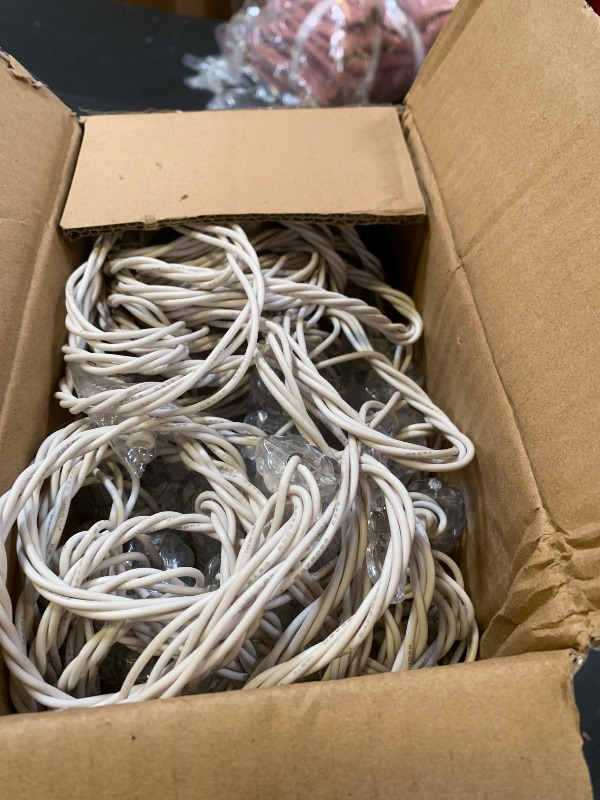 Photo 1 of Minetom Icicle Lights Outdoor with Clips, 2 Pack Total 40ft 200 LED 40 Tubes Twinkling Ice Shape String Lights, Connectable Hanging Christmas Lights Plug in for Eave Holiday Outdoor, Warm White