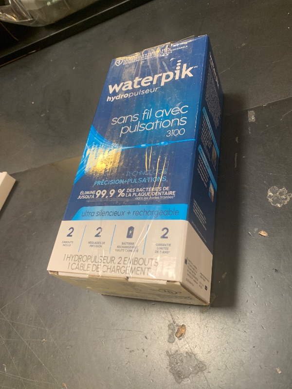 Photo 1 of Waterpik Cordless Pulse 3100 Rechargeable Portable Water Flosser for Teeth, Gums, Braces Care and Travel with 2 Flossing Tips, Waterproof for Shower Use, ADA Accepted, WF-20 White, Amazon Exclusive