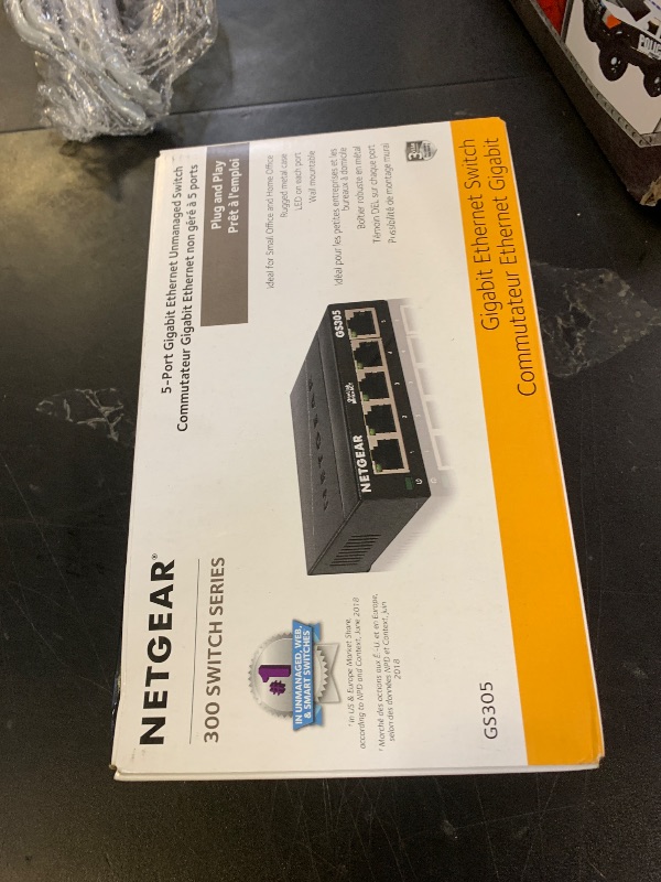 Photo 1 of NETGEAR 5-Port Gigabit Ethernet Unmanaged Essentials Switch (GS305) - Home Network Hub, Office Ethernet Splitter, Plug-and-Play, Silent Operation, Desktop or Wall Mount