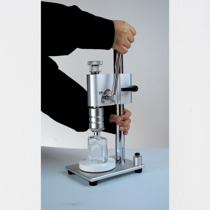 Photo 1 of Manual Perfume Crimper Bottle Capping Machine, Aluminium Plastic Pump Handle Packing Essential Oil Bottle Tool Perfume Crimper Tool 13mm to 20mm (white 15mm)