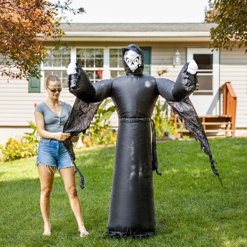 Photo 1 of Sunnydaze 7 ft Grisly Grim Reaper Inflatable Halloween Decoration - Indoor or Outdoor Use - 3 White LED Lights