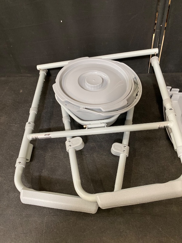 Photo 1 of Drive Medical 11148-1 Folding Steel Bedside Commode Chair, Portable Toilet, Supports Individuals Weighing Up To 350 Lbs, with 7.5 Qt. Bucket and 13.5 Inch Seat, Grey