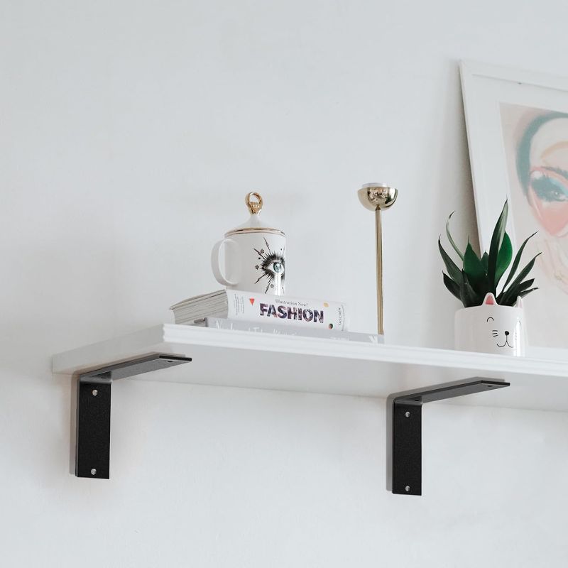 Photo 1 of Black Heavy Duty Shelf Brackets 6 Inch, Rustic Gold Iron L Shelf Bracket, Industrial Modern Metal Floating Shelf with Hardware for DIY Open Shelving, 4 Pack