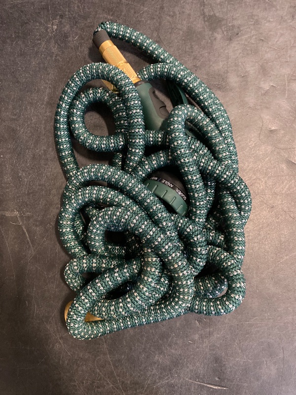 Photo 1 of Expandable Garden Hose 50 ft with 10 Function Nozzle Sprayer, Lightweight & No-Kink Flexible Water Hose with Durable Latex Core & Solid Brass Fittings, 50ft Retractable Stretch Hose, DarkGreen