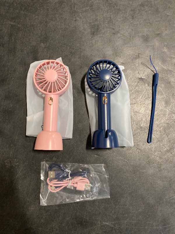 Photo 1 of Warmco Mini Portable Fan 2-Pack - 3 Speed Rechargeable Handheld & Desk Fan with Base, Compact Cooling for Travel, Makeup, Summer Gift (Blue & Pink)