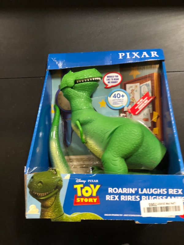 Photo 1 of Mattel Disney and Pixar Toy Story Talking Dinosaur Action Figure with Movng Arms, Roarin’ Laughs Rex Dino Toy, 10.8-inch T Rex with 40+ Sounds & Phrases