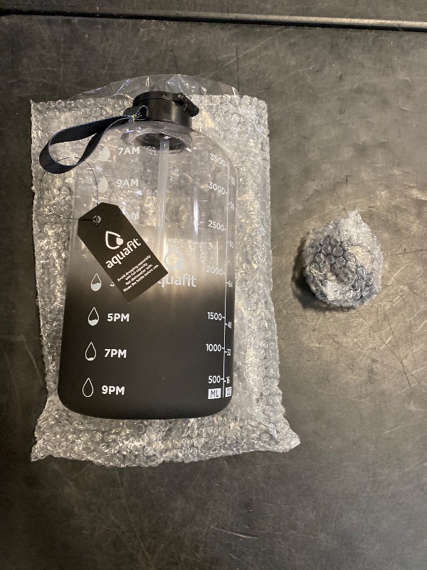 Photo 1 of AQUAFIT 1 Gallon Water Bottle with Time Marker - Straw & Chug Lid - BPA Free Gym Water Bottle with Straw - Big Gallon Jug (Midnight Gray, 128 oz - 2 Lids)