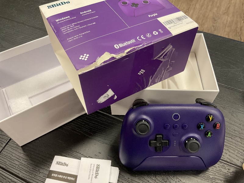 Photo 1 of 8Bitdo Ultimate 2 Wireless Gaming Controller with TMR Joysticks, Switchable Hall Effect/Tactile Triggers, 8Speed Wireless Tech, Charging Dock, RGB Fire Ring for PC & Android - Purper