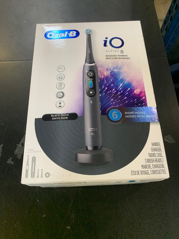 Photo 1 of Oral-B iO Series 8 Electric Toothbrush with 2 Replacement Brush Heads and Travel Case, Rechargeable Toothbrush, Black Onyx