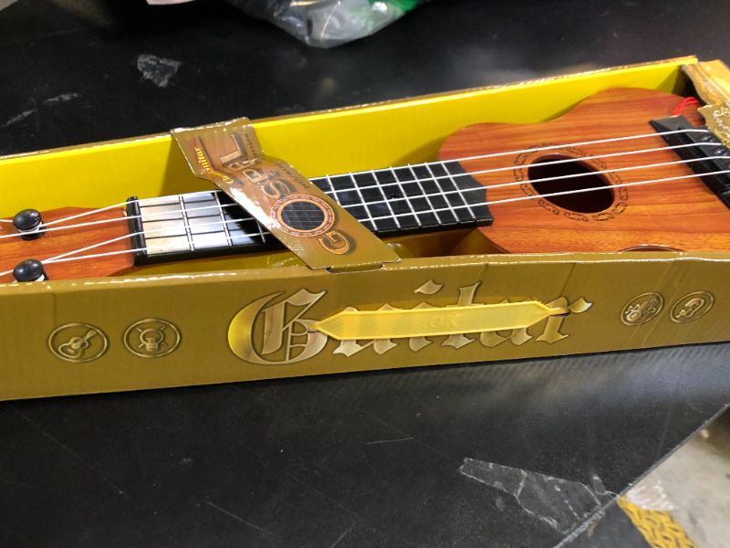 Photo 1 of Kids Toy Ukulele Guitar,17 Inch Classical Guitar Musical Toy,4 Strings Guitar Ukulele Educational Learning Toy for Toddlers and Preschoolers