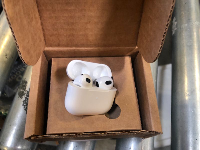 Photo 1 of Apple AirPods (3rd Generation) Wireless Ear Buds, Bluetooth Headphones, Personalized Spatial Audio, Sweat and Water Resistant, Lightning Charging Case Included, Up to 30 Hours of Battery Life
