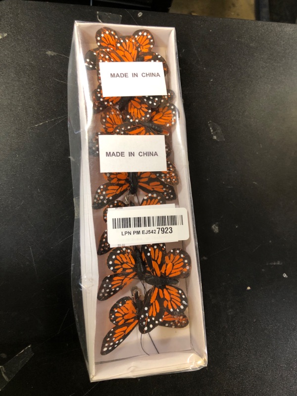 Photo 1 of 12Pcs Monarch Butterfly Clip on Decorations 2.7inches Small Orange Artificial Feather Butterflies for Flower Arrangements Birthday Party Wedding Ornaments Hair Crafts Spring Tree Decor