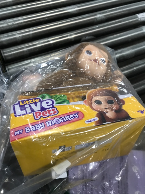 Photo 1 of Little Live Pets My Baby Monkey Mango - Interactive Plush Toy, 50+ Sounds & Reactions, Moving Mouth, Bottle Feeding, Thumb Sucking, Grippy Hands & Feet, Soft Cuddly Stuffed Animal – Gift for Kids 4+