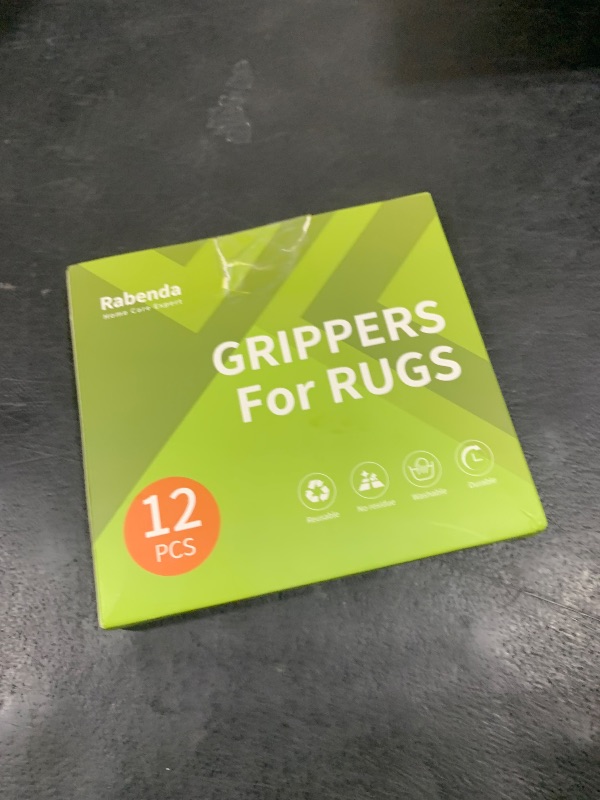 Photo 1 of Rabenda 12 Pcs Rug Tape, Non Slip Rug Pads Grippers for Hardwood Floors and Tiles, Reusable Carpet Tape for Area Rugs, Double-Sided Adhesive Rug Stickers Keep Corners Flat (Black)