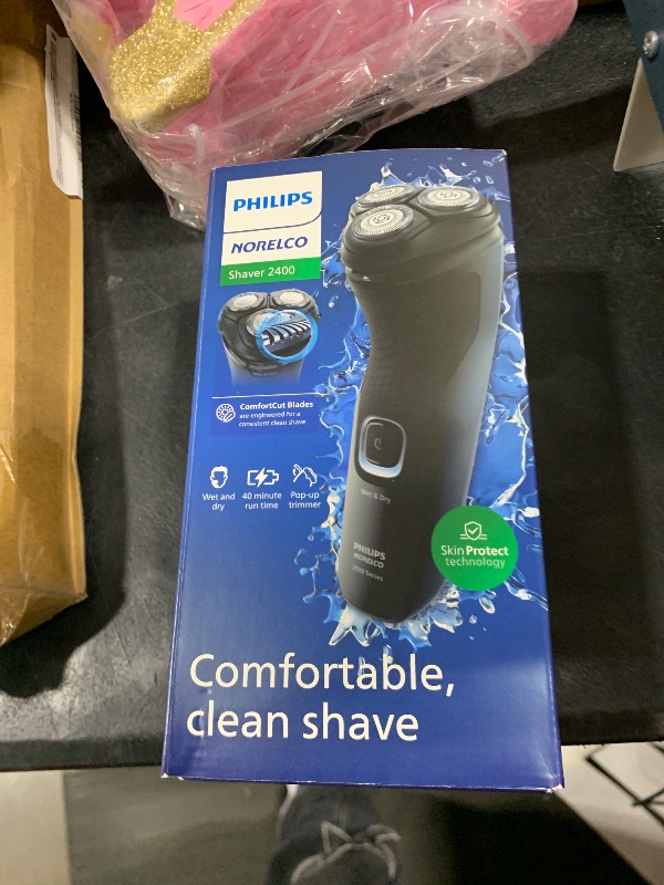 Photo 1 of Philips Norelco Shaver 2400 Series, Wet and Dry Electric Shaver, Pop-up Trimmer, P-Cap, Deep Black, Model X3001/90