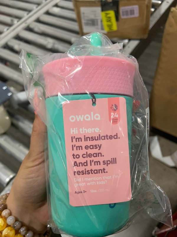 Photo 1 of Owala Kids Insulation Stainless Steel Tumbler with Spill Resistant Flexible Straw, Easy to Clean, Kids Water Bottle, Great for Travel, Dishwasher Safe, 12 Oz, Pink and Teal (Real Cool Fish)