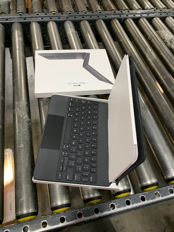 Photo 1 of Apple Magic Keyboard: iPad Keyboard case for iPad Pro 11-inch (1st, 2nd, 3rd, 4th gen) and iPad Air (4th, 5th gen, and M2), Great Typing Experience, Built-in trackpad, US English - Black (Renewed)