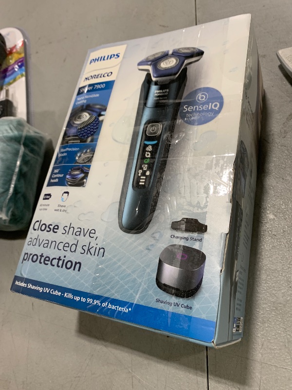 Photo 1 of Philips Norelco Shaver Series 7000, Wet & Dry Electric Shaver with SenseIQ Technology, Pop-up Trimmer, Charging Stand, Travel Case, UV Sanitizing Cube, Model S7889/91
