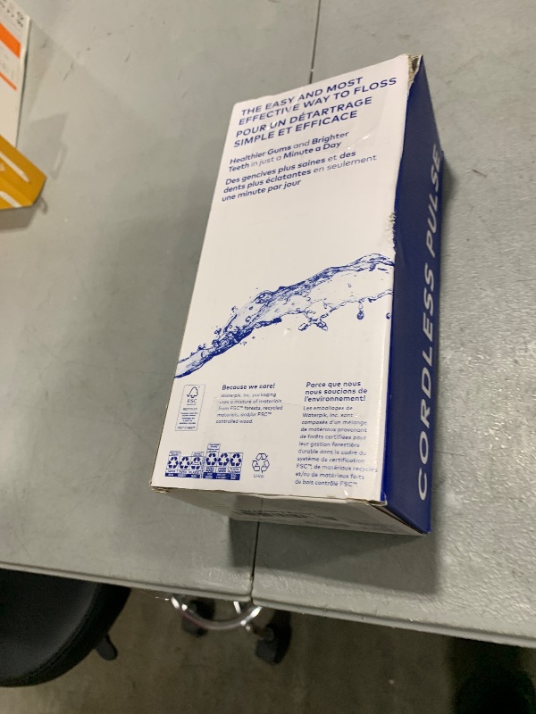 Photo 1 of Waterpik Cordless Pulse Rechargeable Portable Water Flosser for Teeth, Gums, Braces Care and Travel with 2 Flossing Tips, Waterproof, ADA Accepted, WF-20 White, Packaging May Vary