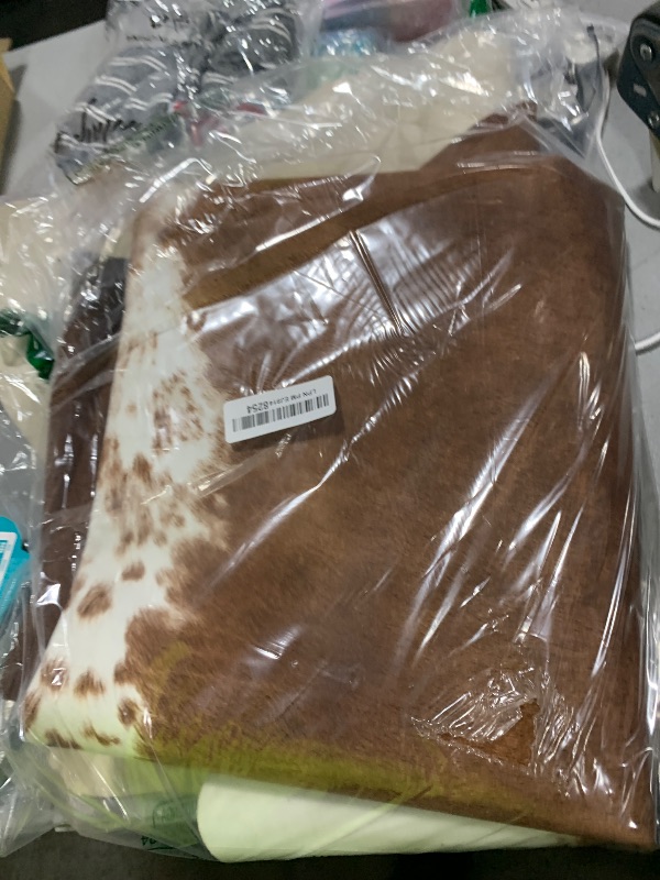 Photo 1 of Faux Cowhide Rug 4.6x5.2 ft Cow Hide Faux Cowhide for Living Room Bedroom Dining Room Home Office Brown Cow Rug Carpet Western for Home Decor-NO Fur