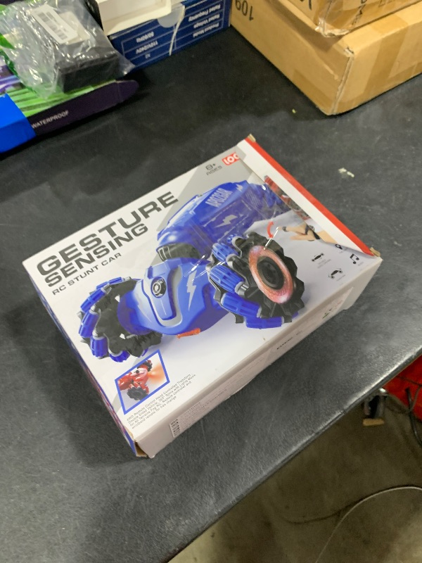 Photo 1 of LOOZIX Upgraded Hand Gesture Sensing RC Stunt Car with Lights Music, Spray Drift Hand Gesture RC Car 360° Spins All Terrains Hand Controlled Truck Toys for 6 7 8 9 10 Year Old Boys