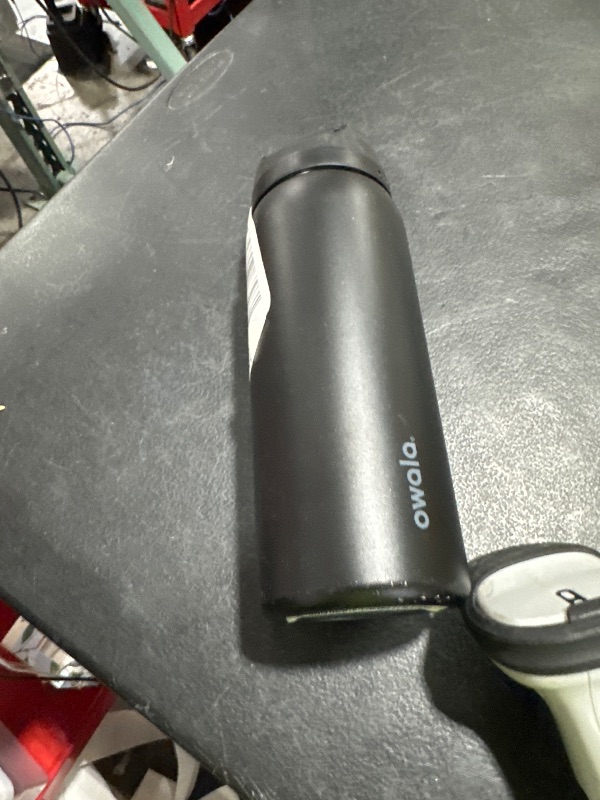 Photo 1 of Owala FreeSip Insulated Stainless Steel Water Bottle with Straw, BPA-Free Sports Water Bottle, Great for Travel, 32 Oz, Very, Very Dark
