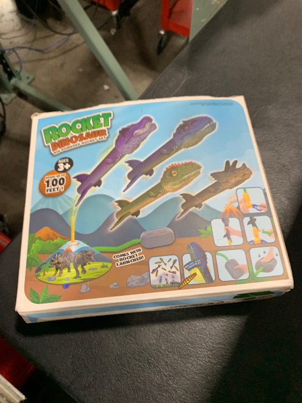 Photo 1 of Gizzjoy Dinosaur Toy Rocket Launcher for Kids - Launch Up to 100 Ft, 4 Rockets, Outdoor Outside Toys for Kids, Dinosaur Toys, Birthday Gifts for 3 4 5 6 7 8-12 Year Old Boys Girls