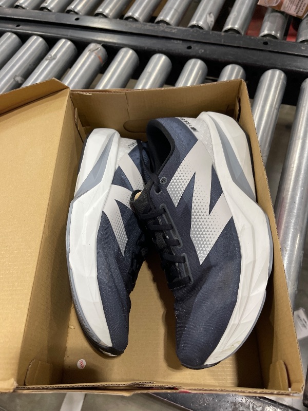 Photo 1 of New Balance Men's FuelCell Rebel V4 Running Shoe, Graphite/Black/Quartz Grey, 10.5 Wide
