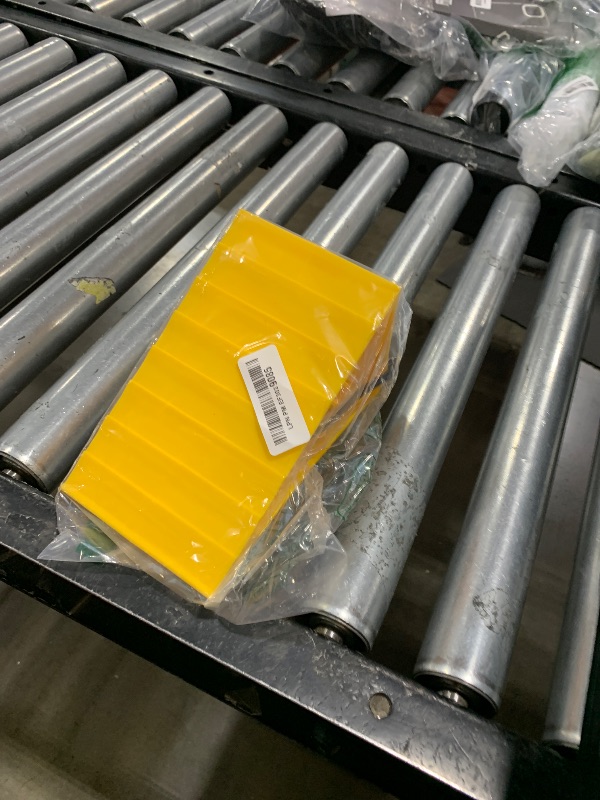 Photo 1 of Camco Standard Wheel Chock w/Rope for Trailers - Heavy Duty RV Wheel Chock Constructed of Durable Plastic w/UV inhibitors - Features Rope Handle for Easy Removal - Use w/Tires Up to 26-in - 44472