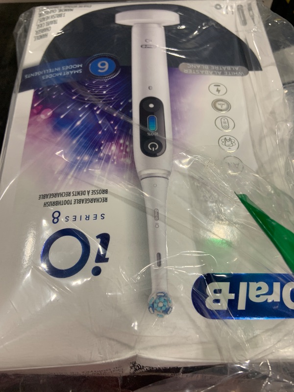 Photo 1 of Oral-B iO Series 8 Electric Toothbrush with 2 Replacement Brush Heads and Travel Case, Rechargeable Toothbrush, White Alabaster