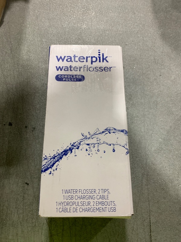 Photo 1 of Waterpik Cordless Pulse Rechargeable Portable Water Flosser for Teeth, Gums, Braces Care and Travel with 2 Flossing Tips, Waterproof, ADA Accepted, WF-20 White, Packaging May Vary