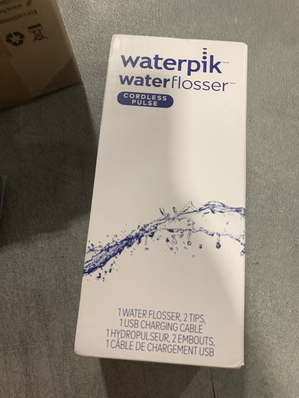Photo 1 of Waterpik Cordless Pulse Rechargeable Portable Water Flosser for Teeth, Gums, Braces Care and Travel with 2 Flossing Tips, Waterproof, ADA Accepted, WF-20 White, Packaging May Vary