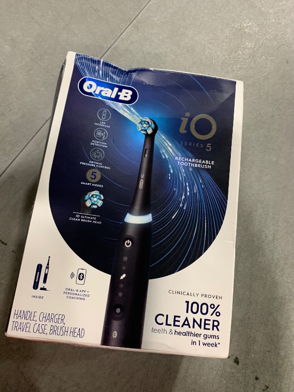 Photo 1 of Oral-B iO Series 5 Rechargeable Electric Toothbrush with Visible Pressure Sensor to Protect Gums, 2 Minute Timer, 5 Cleaning Settings, 1 Replacement Toothbrush Heads, and Travel Case, Black