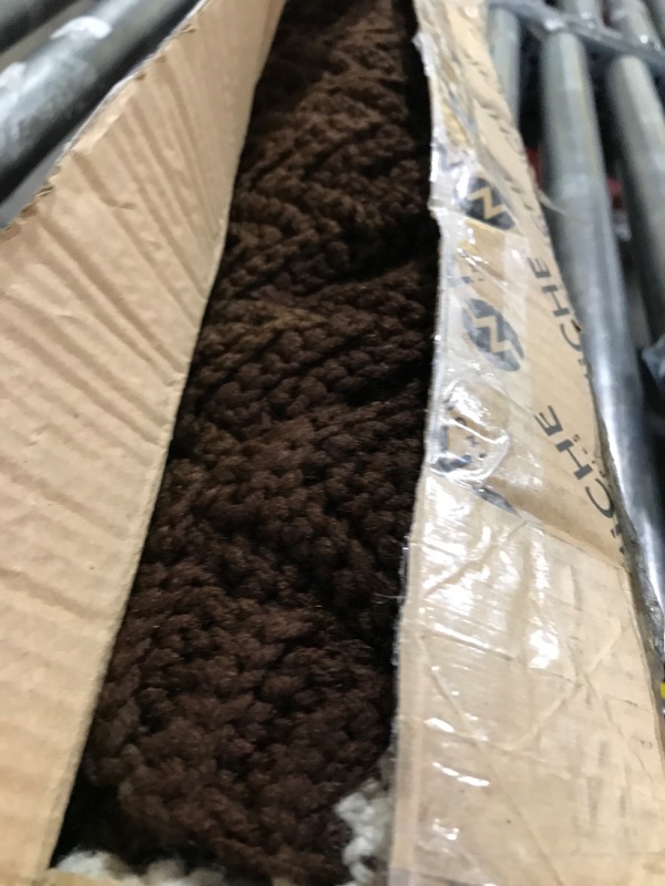 Photo 1 of small brown rug 