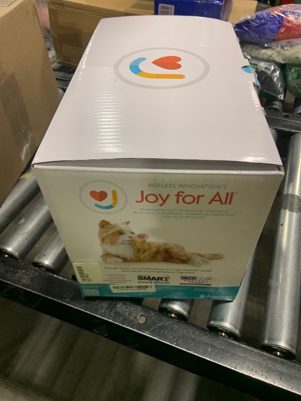 Photo 1 of JOY FOR ALL Companion Pet for Seniors - Lifelike Animatronic Cat - Realistic Soft-Touch Fur & Purring - Therapy Stuffed Animal - Toy for Alzheimer's & Dementia - Orange Tabby
