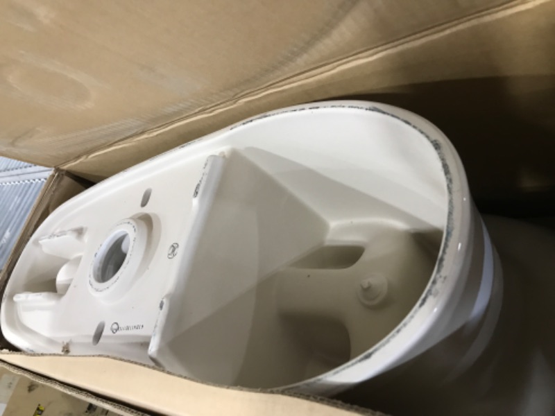 Photo 1 of TOTO Drake Transitional Two-Piece Elongated 1.28 GPF TORNADO FLUSH Toilet with CEFIONTECT, Cotton White - CST786CEG#01