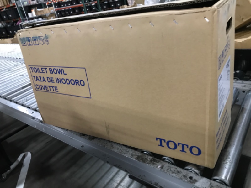 Photo 1 of TOTO Drake Transitional Two-Piece Elongated 1.28 GPF TORNADO FLUSH Toilet with CEFIONTECT, Cotton White - CST786CEG#01