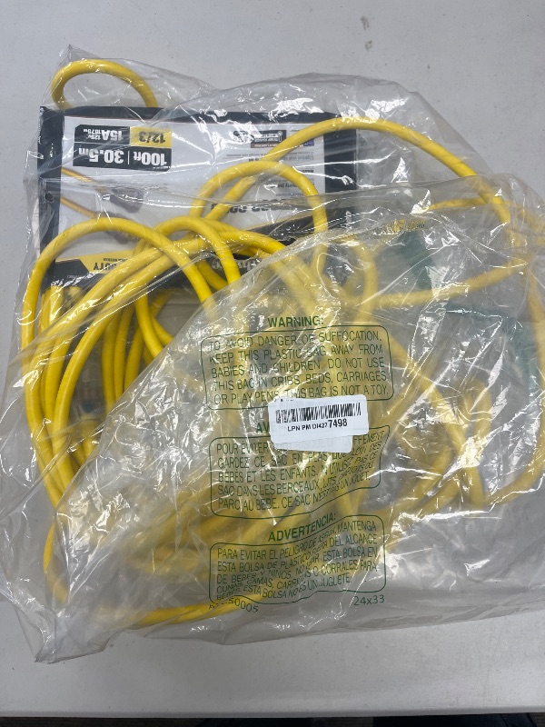 Photo 1 of Southwire Outdoor Extension Cord, 100 Ft, 12 gauge 3 prong, Heavy Duty, SJTW Cord, Yellow, 2589