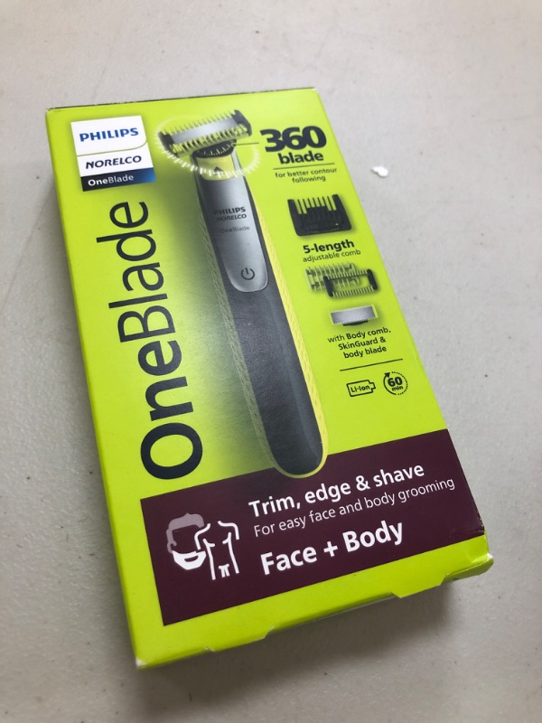 Photo 1 of Philips Norelco OneBlade 360 Hybrid Blade for Face + Body, Electric Beard Trimmer, Shaver and Groomer, with 360 Blade Technology, 5in1 Adjustable Comb, 1x Body Kit, Model QP2834/70, Black/Lime Green