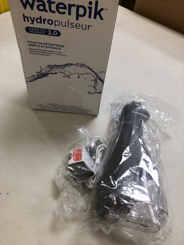 Photo 1 of Waterpik Cordless Advanced 2.0 Water Flosser For Teeth, Gums, Braces, Dental Care With Travel Bag and 4 Tips, ADA Accepted, Rechargeable, Portable, and Waterproof, Gray WP-587, Packaging May Vary