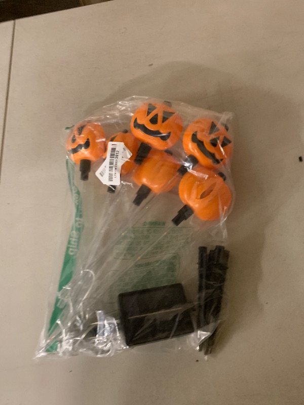 Photo 1 of 12 Pack Solar Pumpkin Lights for Halloween Decorations Outdoor, Waterproof Halloween Pathway Lights with 8 Modes, Orange Purple and Green Halloween Walkway Stake Lights for Yard Garden Party Decor